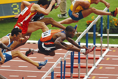 ATLETIEK:WERELDKAMPIOENSCHAPPEN 2003:PARIJS;28AUGUSTUS2003- Stijlvol gaat Gregory Sedoc met voorsprong over de 2de horde bij de 110 meter Copyright: Soenar Chamid