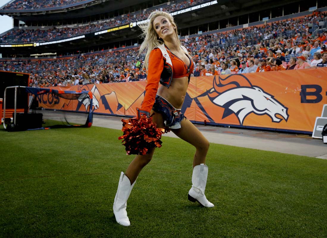 A Denver Broncos cheerleader performs during the first half of an NFL preseason football game against the Arizona Cardinals, Thursday, Sept. 3, 2015, in Denver. (AP Photo/Jack Dempsey)