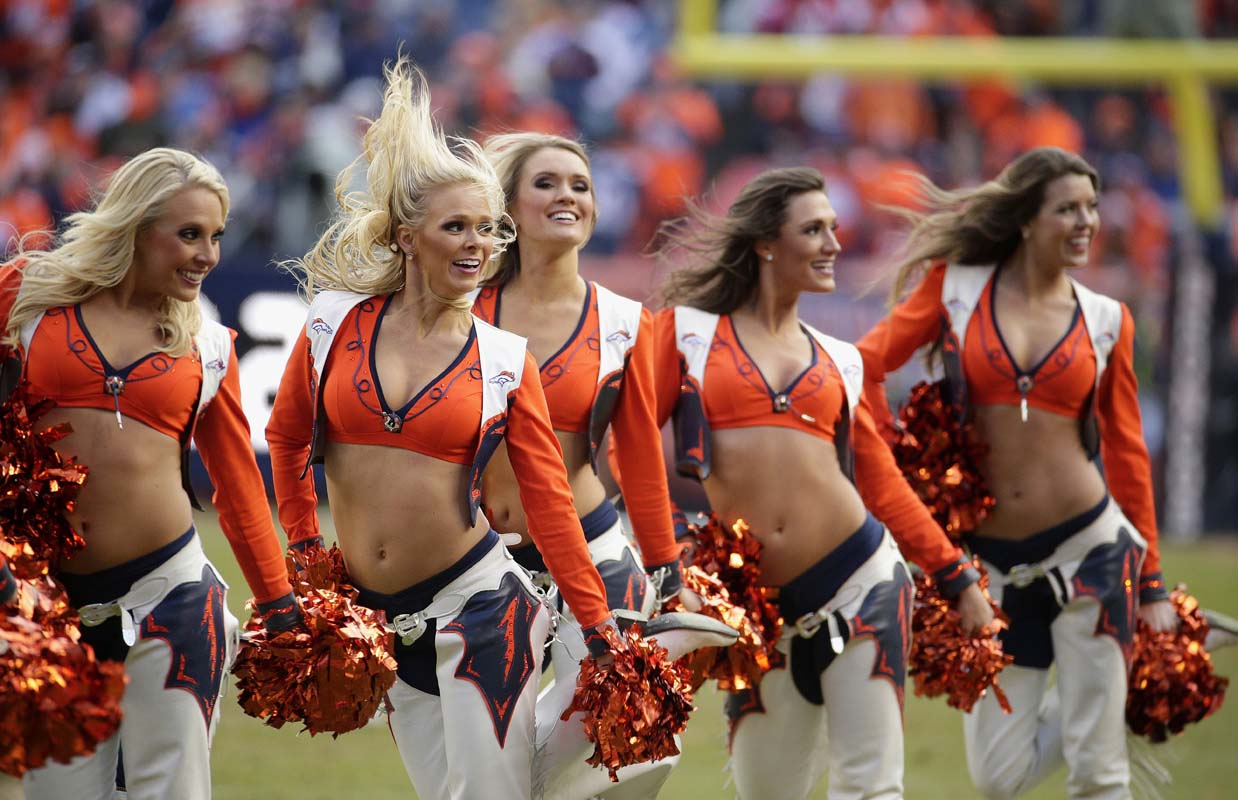 Denver Broncos cheerleaders perform during the first half of the NFL football AFC Championship game between the Denver Broncos and the New England Patriots, Sunday, Jan. 24, 2016, in Denver. (AP Photo/Charlie Riedel)