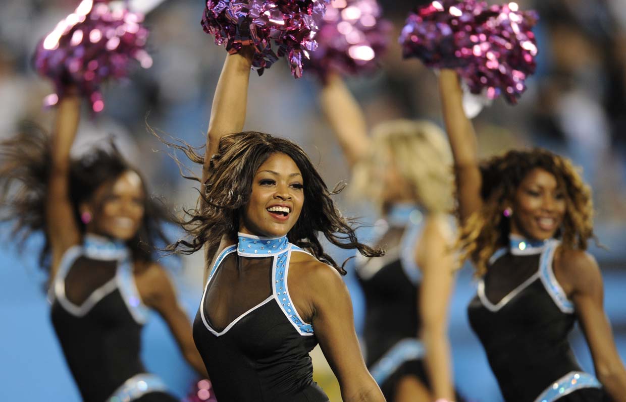 A Carolina Panthers cheerleader performs in the first half of an NFL football game in Charlotte, N.C., Sunday, Oct. 25, 2015. (AP Photo/Bob Leverone)