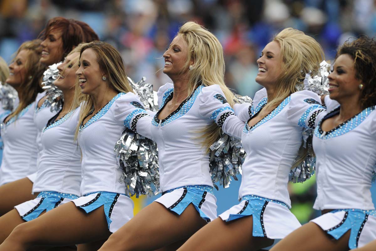 Carolina Panthers cheerleaders perform in the first half of an NFL football game against the New Orleans Saints in Charlotte, N.C., Sunday, Sept. 27, 2015. (AP Photo/Mike McCarn)